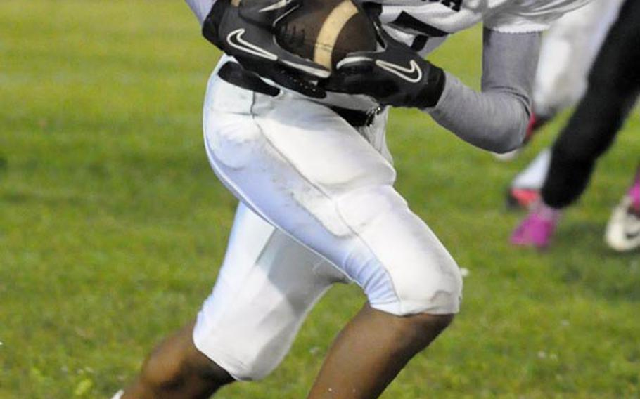 Zama American cornerback Raymond Bestor takes off on a 64-yard return with an interception near the end of the first half during Friday's Far East Division II football game at Misawa Air Base, Japan.