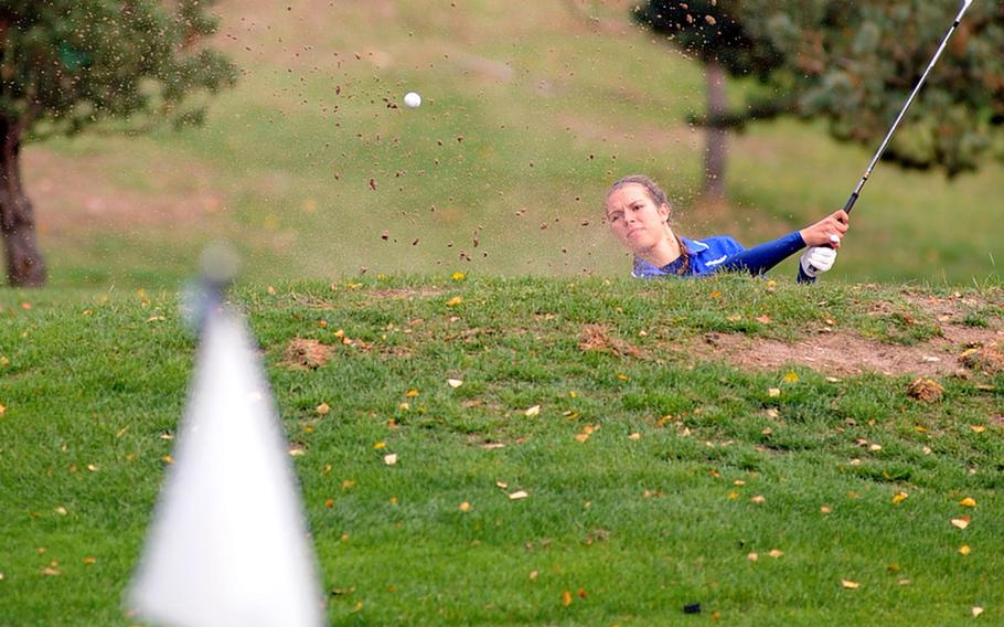Defending champion Jenna Eidem of Wiesbaden hits out of the bunker on 18 at the end of the first round of the DODDS-Europe golf championships at the Heidelberg Golf Club, Thursday. Eidem shot a modified Stableford 39 to lead going into Friday's final round. She is followed by Ashley Kranz, Demetrah Lewis and Michelle Turner of Ramstein.