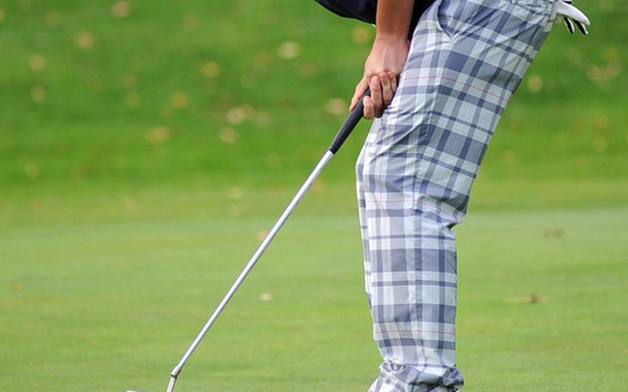 Lakenheath's Kyler Zachary watches as his putt fall into the cup on the 18th hole in opening day action at the DODDS-Europe golf championships at the Heidelberg Golf Club on Thursday. Zachery is tied for fourth with Bahrain's Ilya Goniker going into Friday's final round, after shooting a modified Stableford 44.