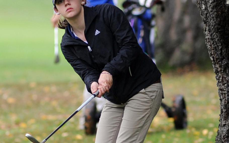 Ramstein's Ashley Kranz chips to the green in final round action at the DODDS-Europe golf championships. Kranz finished second behind defending champion Jenna Eidem of Wiesbaden, seen behind her.