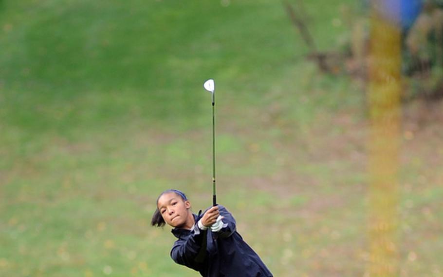 Ramstein's Demetrah Lewis follows her ball towards the pin in final round action at the DODDS-Europe golf championships. Lewis finished fourth with a modified Stableford 43.