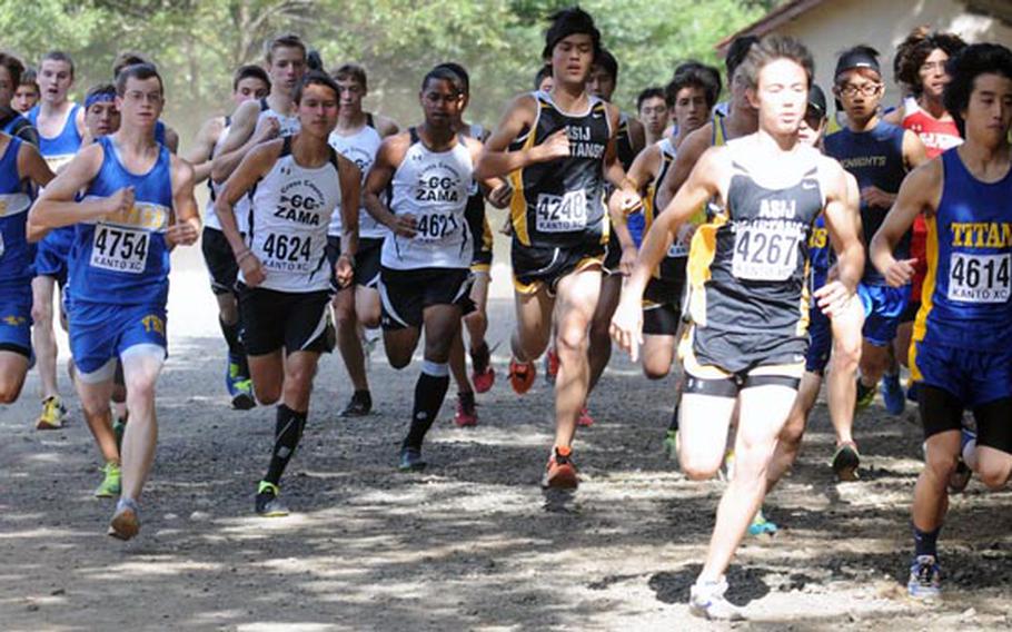 Robert Beard of Nile C. Kinnick, far left, prepares to round the first turn with the field just after the start of the boys varsity race in Saturday's Kanto Plain Association of Secondary Schools cross country finals at Tama Hills Recreation Center, Tokyo. Beard won the 2.9-mile boys race in 15 minutes, 17 seconds and Samantha Arnold of Yokota the girls 2.1-mile race in 13:14, the first time in recent memory that DODDS runners won both races.