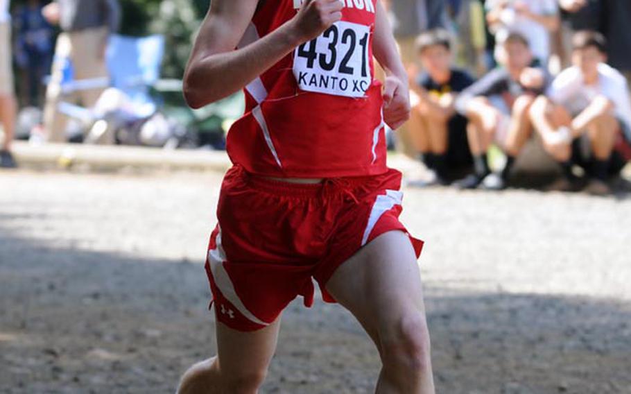 Robert Beard of Nile C. Kinnick pounds for the finish line in the boys varsity race in Saturday's Kanto Plain Association of Secondary Schools cross country finals at Tama Hills Recreation Center, Tokyo. Beard won the 2.9-mile boys race in 15 minutes, 17 seconds and Samantha Arnold of Yokota the girls 2.1-mile race in 13:14, the first time in recent memory that DODDS runners won both races.