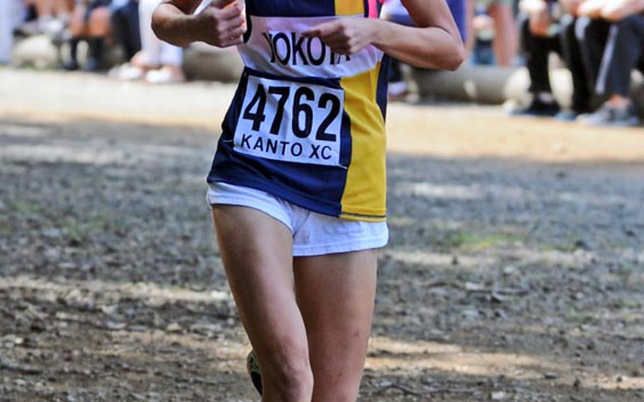 Samantha Arnold of Yokota heads for the finish line in the girls varsity race in Saturday's Kanto Plain Association of Secondary Schools cross country finals at Tama Hills Recreation Center, Tokyo.