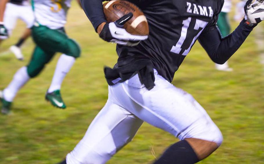 Zama American running back Mitchell Harrison runs for daylight against the Robert D. Edgren during Friday's game at Camp Zama, Japan. Zama won 40-17 and clinched host rights to the Nov. 10 D-II title game.