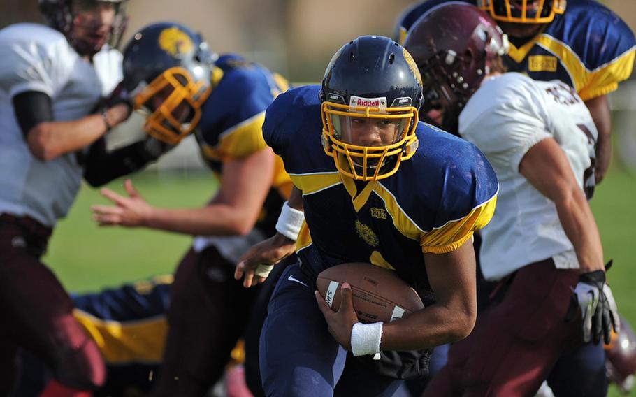 Heidelberg quarterback Timothy Cuthbert breaks through the Vilseck line for the first of his two second half touchdowns. The Lions lost their final football game 34-26 to the visiting Falcons.