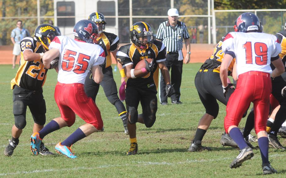 Curtis Hobson dashes through a wide-open hole created by Patch's dominant offensive line in the Panthers' 31-8 victory Saturday over Lakenheath. The offensive line opened holes all day for Patch runners.