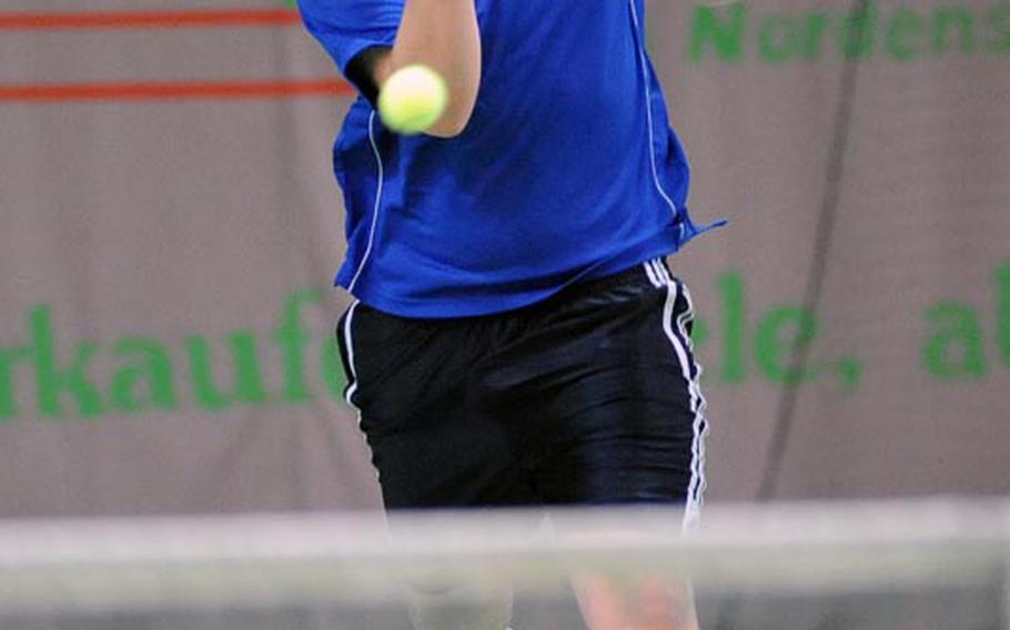 Max Hale of Brussels rushes towards the net to return a shot by Incirlik's Jesse Wiseman. Hale won the first-round match 6-1, 6-0 at the DODDS-Europe tennis championships, Thursday.