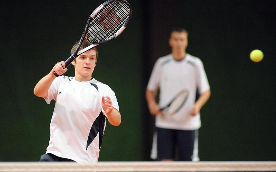 Alconbury's Jeff Black returns a shot at the net in a first-round doubles match against Baumholder at the DODDS-Europe tennis championships. Black and his partner Joey Behr beat Joshua Milo and  Robert King 6-1, 6-1.