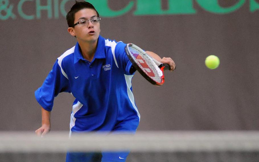 Incirlik's Jesse Wiseman returns a shot at the net from Max Hale of Brussels. Hale won the first-round match 6-1, 6-0.