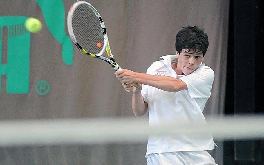 Fabian Sandrup Selvik of International School of Brussels returns a shot by SHAPE's Dimitrios Stavropoulos in their semifinal match at the DODDS-Europe tennis championships, Friday. Stavropoulos won the match 6-1, 6-0.