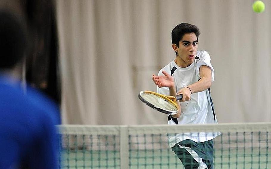 SHAPE's Fragkiskos Fratzis returns a Ramstein shot in a doubles semifinal match at the DODDS-Europe tennis championships. Fratzis and teammate Aaron Yip lost to Ramstein's Aryan von Eicken and Lee DeBose 6-0, 6-1.