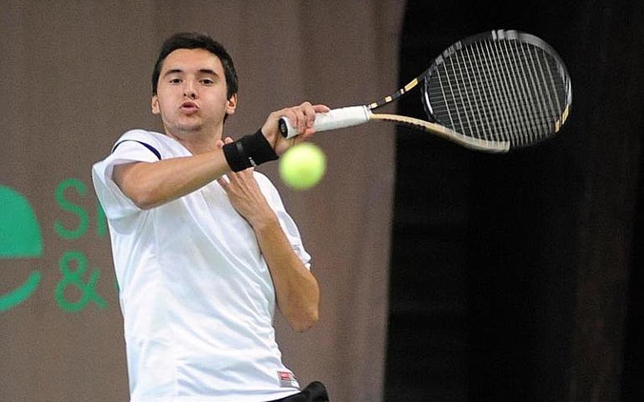 Two-time defending champ Ajdin Tahirovic of Patch returns a serve from Lakenheath's Peter Kovats in a semifinal at the DODDS-Europe tennis championships. Tahirovic will meet SHAPE's Dimitrios Stavropoulos Saturday, in a rematch of last year's final.