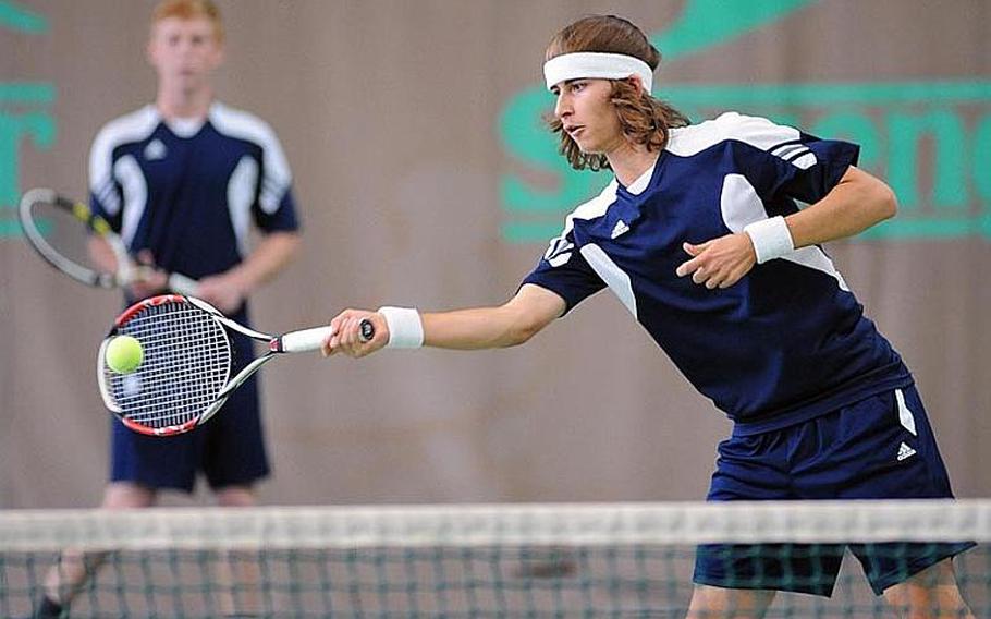 Heidelberg's Jack Kolodziejski returns a Patch shot as teammate Wylder Raney watches. The top-seeded duo defeated Patch's, Alex Srodowski and Dylan Rehwaldt the tourney's fourth seeds, 7-6 (8-6), 6-7(6-8), 6-3, in an exciting semifinal at the DODDS-Europe tennis championships.