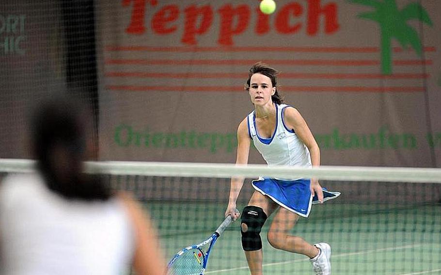 Defending champion and this year's fourth seed Meghan Augsburger of Ramstein watches her ball sail over the net in her semifinal match at the DODDS-Europe tennis championships. Augsburger lost to this year's top seed Eugenia Srodowski of Patch 6-1, 6-4.