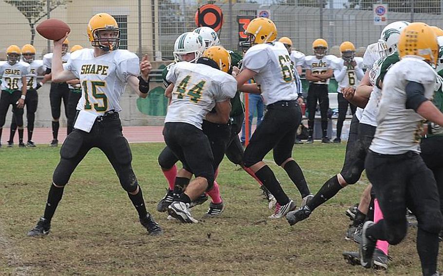 SHAPE quarterback Brett Cain gets set to throw Saturday during the Spartans' 21-16 loss to Naples.