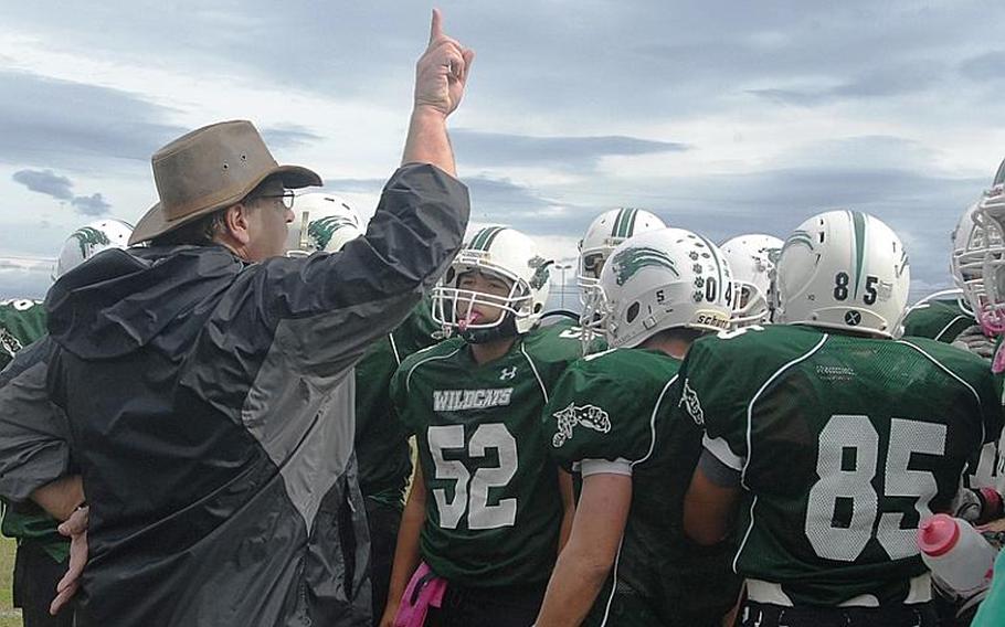 Naples head coach Steve Altstiel gives a pep talk to his team Saturday during a second-half timeout. Naples went on to beat the SHAPE Spartans 21-16 to advance to the DODDS-Europe Division II championship game.