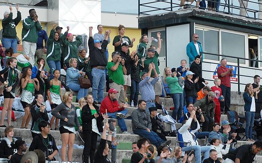 Fans in Naples left the football stadium wet but happy Saturday as the home team prevailed 21-16 over SHAPE in a Division II playoff game.