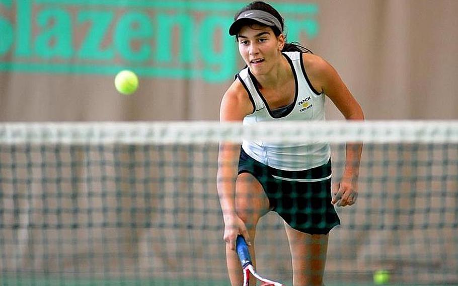 Patch's Eugenia Srodowski rushes to the net to return a shot by AFNORTH's Alexandria Bellas in the girls singles final at the DODDS-Europe tennis championships. Srodowski took the title with a 1-6, 6-3, 7-5 win.