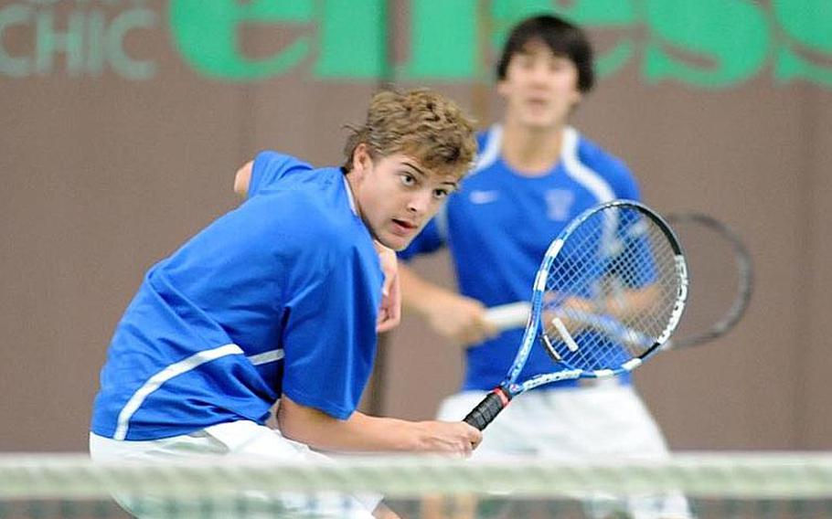 Ramstein's Aryan Von Eicken, left, follows his shot over the net as teammate Lee DeBose watches. The Ramstein duo defeated Heidelberg's Jack Kolodziejski and Wylder Raney 6-2, 6-1 to capture the 2012 DODDS-Europe boys doubles title.