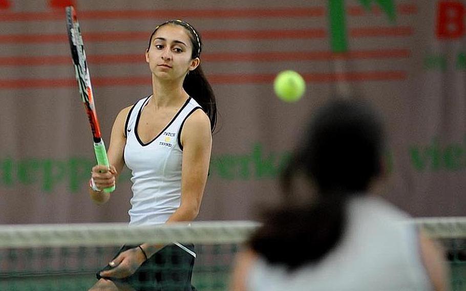 Patch's Christine Young, left, knocks the ball past Ramstein's Jennifer DuBose in the girls doubles final at the  2012 DODDS-Europe tennis championships. Young and teammate Marina Fortun beat DuBose  and Sydney Townsend 7-6 (9-7), 1-6, 6-4 for the title.