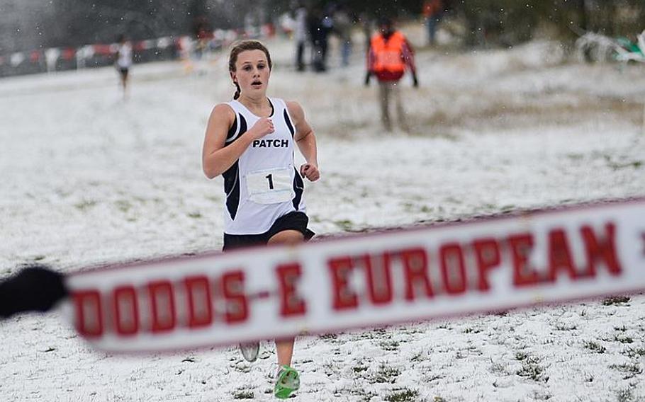 Patch's Baileigh Sessions sprints to a first-place finish with a time of 20:20.04 in the girls 2012 DODDS-Europe cross country championships at the Rolling Hills golf course in Baumholder, Germany.