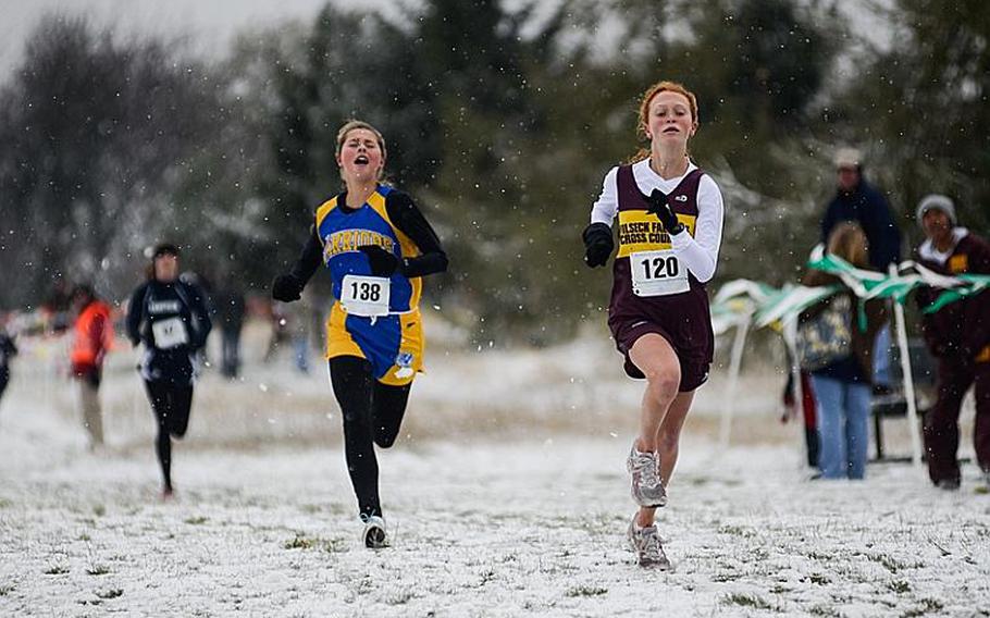 Vilseck's Kirsten Carson sprints to the finish line with Wiesbaden's Anna Seiferth close behind in the girls 2012 DODDS-Europe cross country championships Saturday at the Rolling Hills Golf Course in Baumholder, Germany.