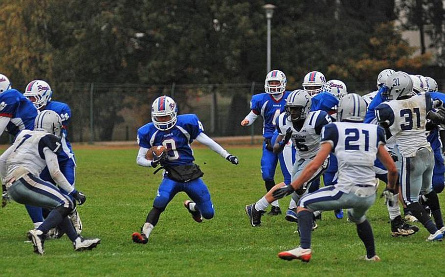 Ramstein running back Young Jae Oh takes a handoff and finds a hole in the Bristol Academy defense in Ramstein's 34-0 win over Bristol Academy on Saturday at Ramstein.