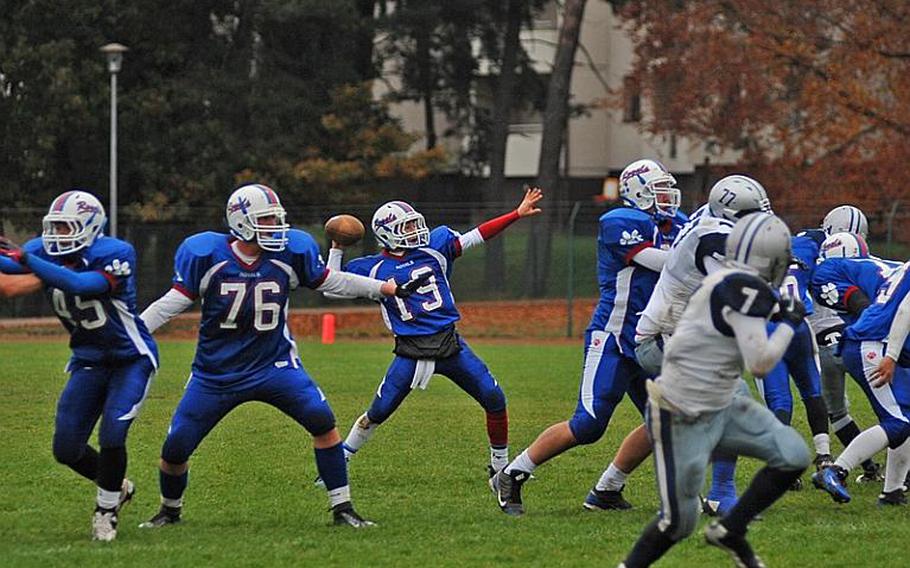 Ramstein quarterback Lucas Mireles throws a pass in Ramstein's 34-0 win over Bristol Academy on Saturday at Ramstein.