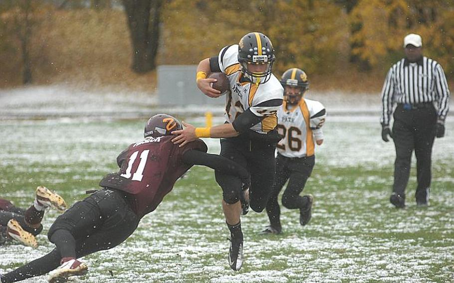 Senior Patch quarterback Jack Smith evades tackle during Saturday's DODDS-Europe Divsion I semifinal game at Vilseck. The Panthers won, 30-8, and will face Ramstein for the championship next Saturday.