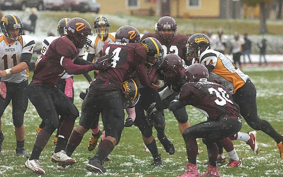 Vilseck players swarm a Patch ball-carrier during Saturday's DODDS-Europe Division I semifinal game against the Patch Panthers. The Panthers won, 30-8, and will play Ramstein for the championship next Saturday.