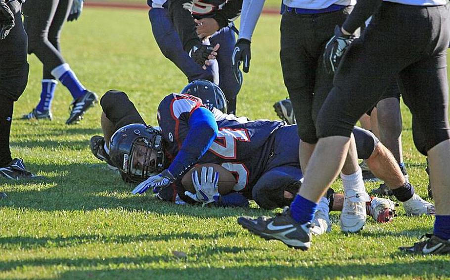 Bitburg Barons running back Bryson Randall lays on the turf after scoring one of his three touchdowns in his team's 56-14 victory Saturday over visiting Hohenfels.