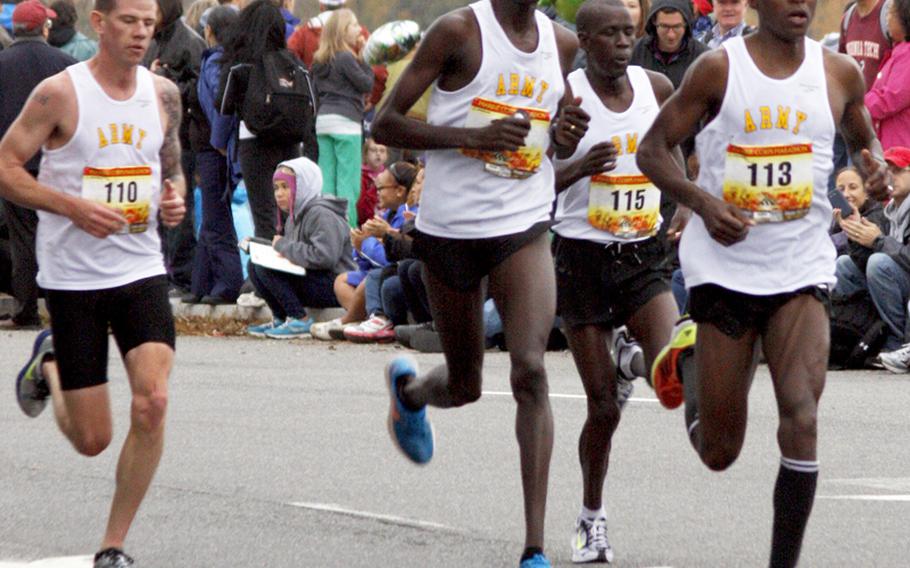 Four U.S. Army teammates lead the way near the 11-mile mark of Sunday's Marine Corps Marathon. Eventual winner Spc. Augustus Maiyo, right, is followed by Spc. Robert Cheseret, Spc. Joseph Chirlee (115) and Spc. Kyle Heath (110).