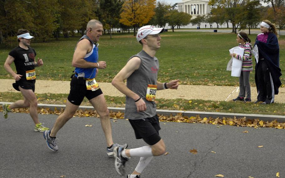 With the Jefferson Memorial in the background, Marine Corps Marathon runners head for the 16-mile checkpoint.
