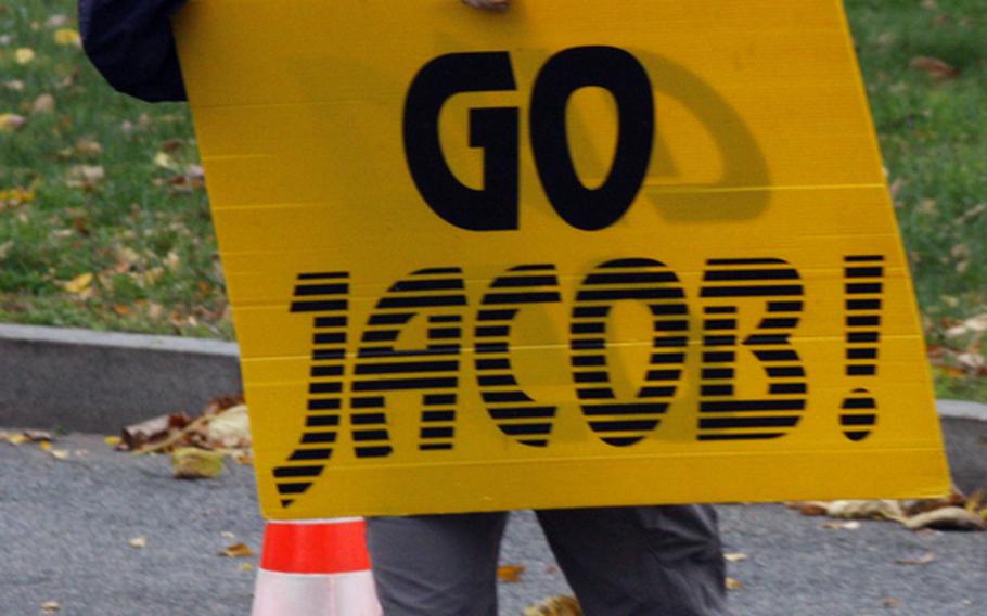 A Marine Corps Marathon competitor gets encouragement from the sidelines.