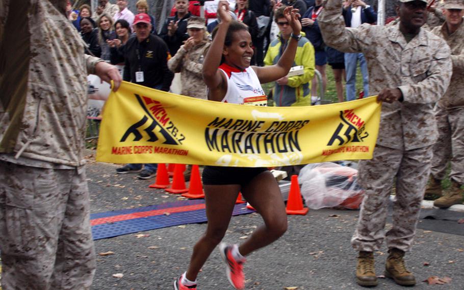 Hirut Guangul is the first woman to cross the finish line at the Marine Corps Marathon on Oct. 28, 2012. Guangul finished with a time of 2:42:03.