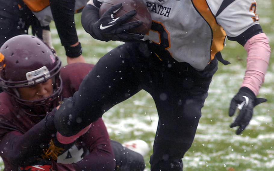 Patch senior running back Curtis Hobson shakes a tackler during a DODDS-Europe Division I semifinal game at Vilseck last weekend. The Panthers won, 30-8, and will play Ramstein for the championship on Saturday.