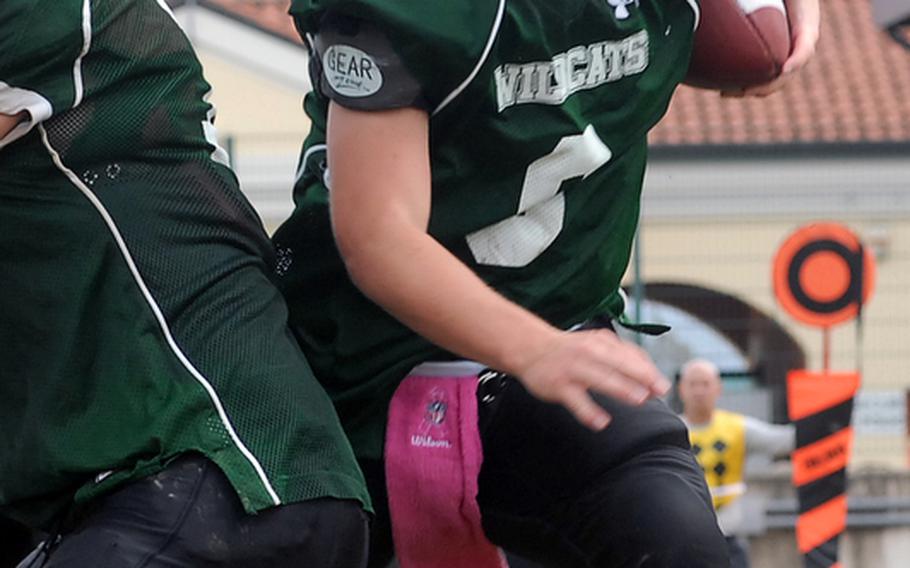 Naples quarterback Joseph Pitts follows a blocker in the Wildcats' 21-16 semifinal win over SHAPE on Saturday.