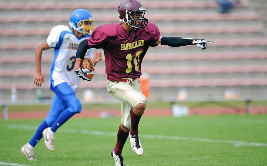 Baumholder's Ben McDaniels directs his blockers as he rushes upfield in a game against Sigonella in September.