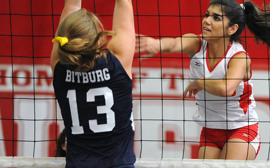 Kaiserslautern's Grace Gonzales, right, slams the ball over the net against Bitburg's Brandy Oliver in a match in Kaiserslautern on Sept. 22. Kaiserslautern is seeded fourth in Division I and the Barons are the fifth seed in Division II.