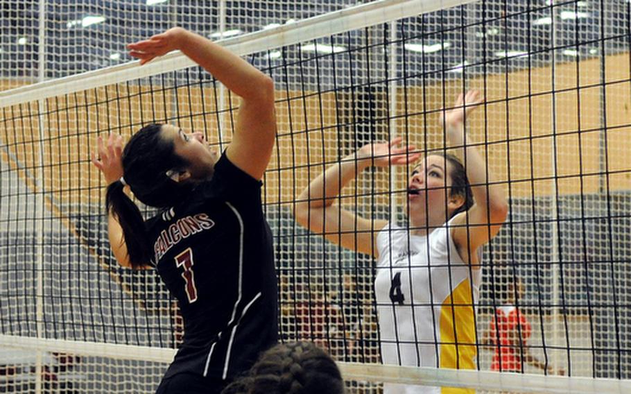 Vilseck's Alex Lopez leaps to return the ball while Patch's Melissa Call readies to defend during a game Sept. 29, 2012 at Patch High School. Both teams will be competing in Division I when the DODDS-Europe volleyball championships that get under way Thursday in the Kaiserslautern Military Community. Patch is seeded third and the Falcons are the seventh seed.