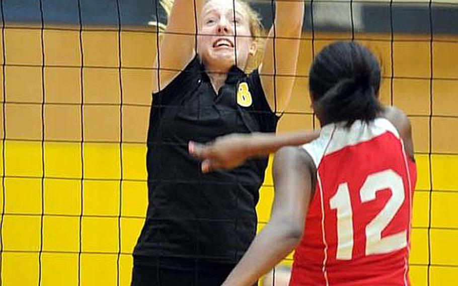 Coaches of 15 Far East Girls Division I Volleyball Tournament teams must figure out how to buckle down and stop junior Liz Thornton, left, reigning tournament Most Valuable Player of reigning champion American School In Japan.