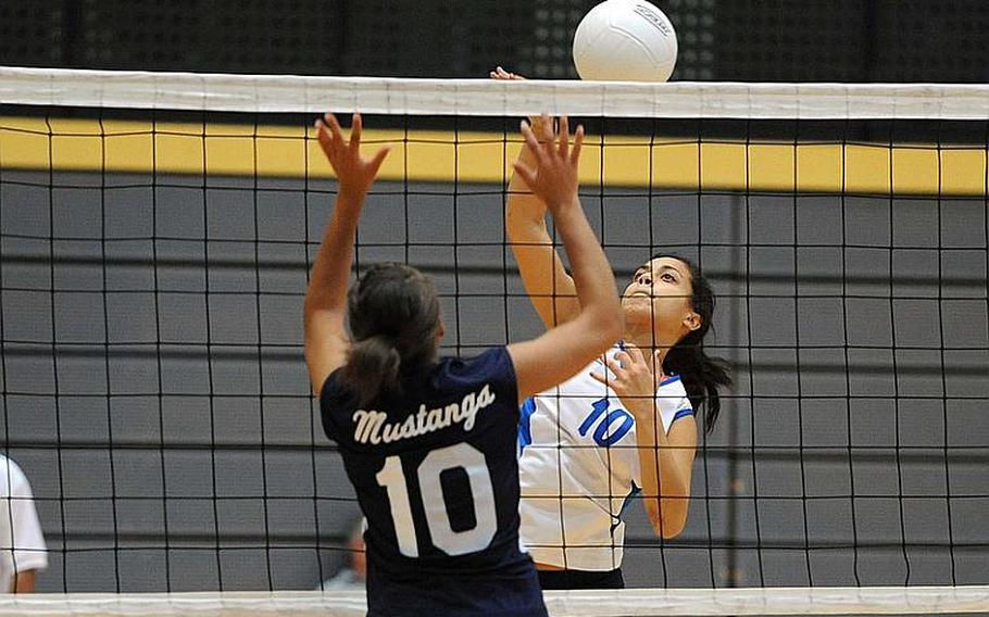 Rota's Natalia Rivera knocks the ball over the net against Menwith Hill's Arielle Rogers. Rota won the Division III semifinal 25-17, 25-15, 25-15 and will face Sigonella in Saturday's final.
