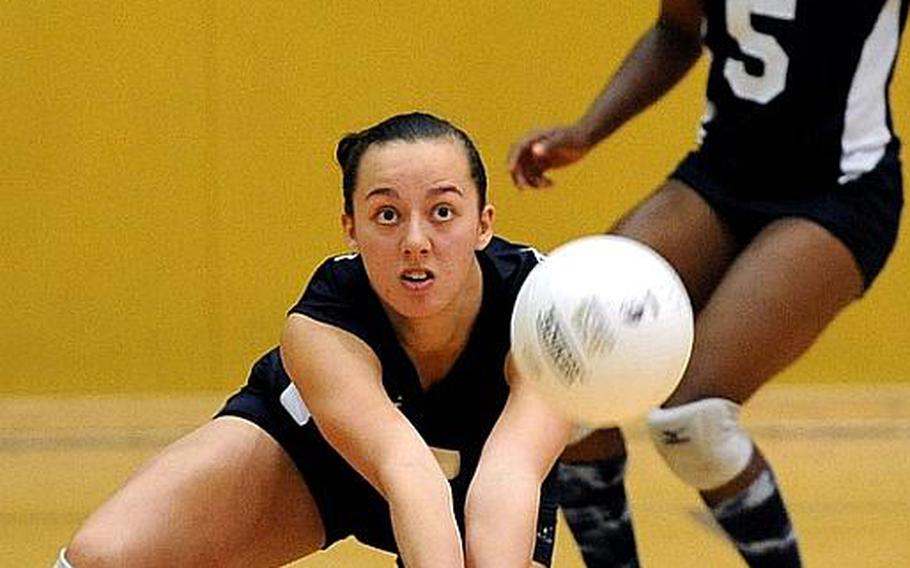 Menwith Hill's Kaia Pierce digs deep to return a Rota serve in a Division III semifinal match at the DODDS-Europe volleyball championships. Rota won 25-17, 25-15, 25-15 and will face Sigonella  in Saturday's final.