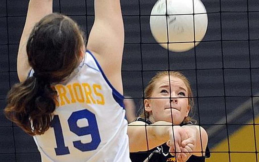 Heidelberg's Larla Halsey bumps the ball over the net against Wiesbaden's Ellen Tayfoya in a Division I match won by Heidelberg 25-20, 23-25, 25-23.