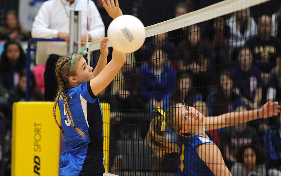Sigonella's Rachel Vosler, right, watches her ball get past Rota's Tiffani Driscoll in the Division III final at the DODDS-Europe volleyball championships. Rota took its third straight Division III title with a  25-18, 25-23, 25-19 win.