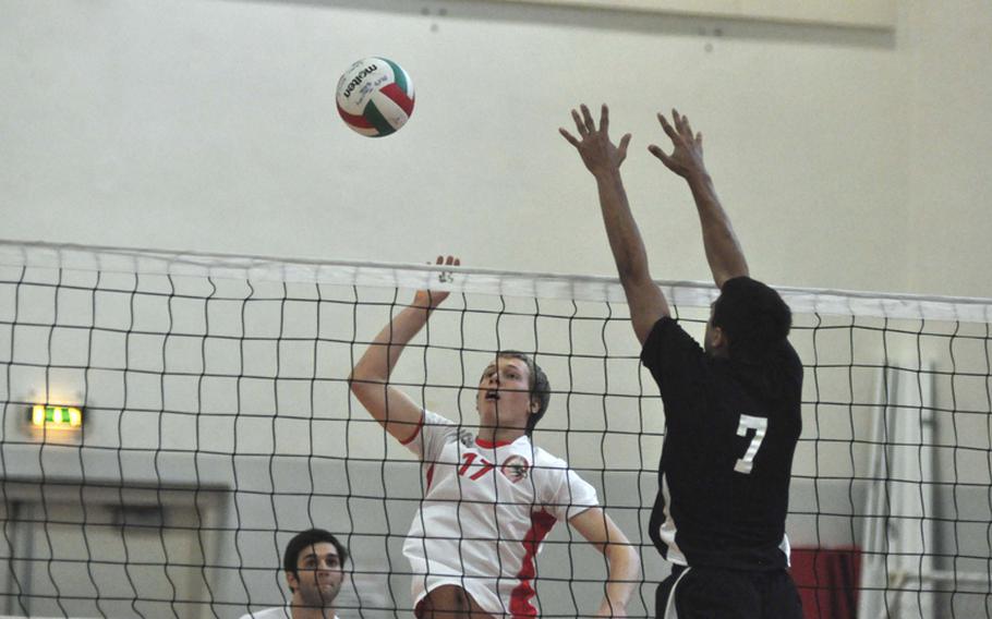 American Overseas School of Rome's Colin Cook tries to hit the ball past the block of Vicenza's Derrick Schaefer during pool play Saturday morning in the 2012 Mediterranean Volleyball Championships at Aviano Air Base, Italy. AOSR stayed unbeaten on the year with a 25-17, 22-25, 15-12 victory and advanced to the championship game.