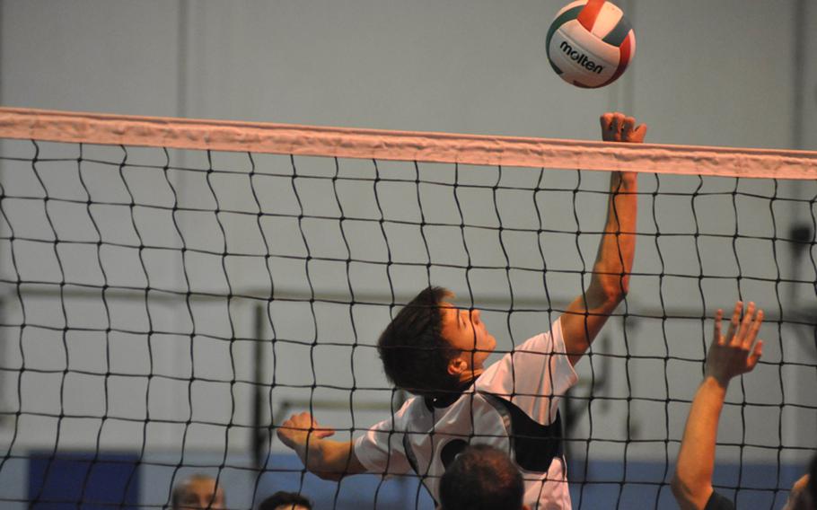 Aviano's Matthew O'Brien dinks the ball over the net Saturday in pool play at the 2012 Mediterranean Volleyball Championships. The Saints fell to Ankara 16-25, 29-27, 15-9.