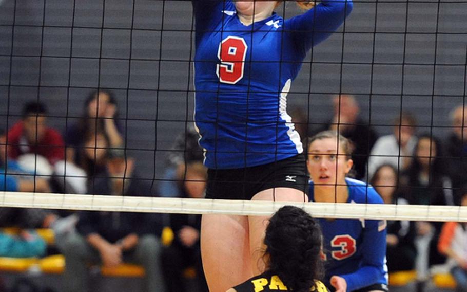 Ramstein's Sarah Schiller knocks the ball over the net against Patch's Stephanie Trujillo in the Division I final at the DODDS-Europe volleyball championships in Ramstein, Saturday. The Royals beat Patch 25-12, 25-14, 25-19 to defend their title.