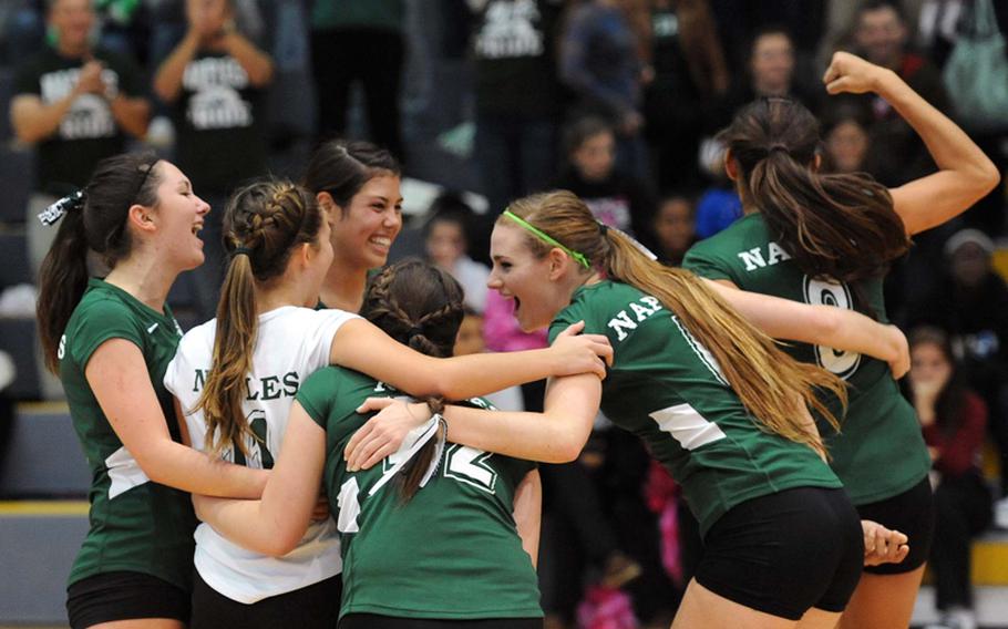 Defending Division II champions Naples celebrate its 2012 title after defeating Ansbach 23-25, 25-20, 25-17, 25-18 at the DODDS-Europe volleyball championships in Ramstein, Saturday.